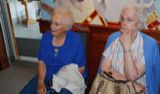 Nancy and Sylvia, looking fetching in blue, wait for a table.