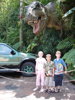 Three children with dinosaur