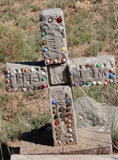 A child's grave - marbles on the headstone.